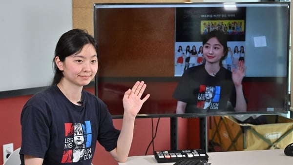 An engineer from Pulse9 conducting a demonstration as a live actor for virtual human Zaein, seen on-screen