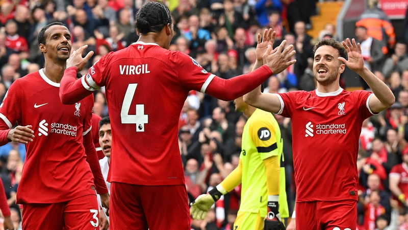 Liverpool players celebrate after Digo Jota scores their third goal against West Ham