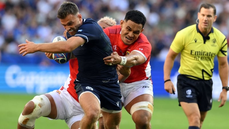 Ben White attempts to escape the clutches of Tonga's Sione Havili Talitui