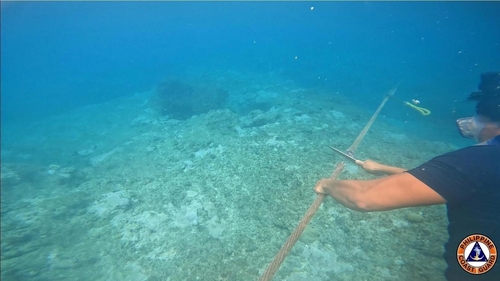 The Philippines removed a floating barrier installed by China to block Philippine fishing boats