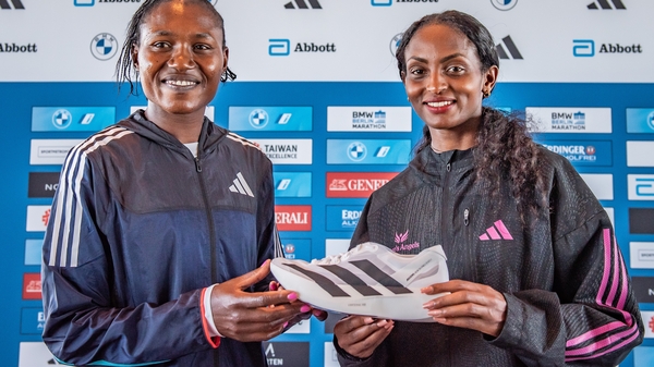 Sheila Chepkirui from Kenya and Tigist Assefa from Ethiopia holding the Adidas Running Shoes Adizero Adios Pro Evo 1 Lightstrike Pro ahead of the 2023 BMW Berlin-Marathon