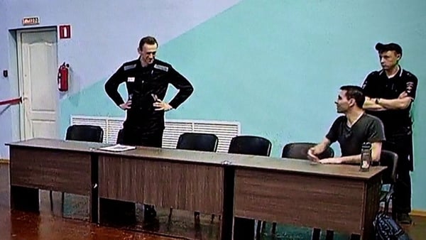 Russian opposition figure Alexei Navalny, left, has lost his appeal against a 19-year term prison term (File Photo)
