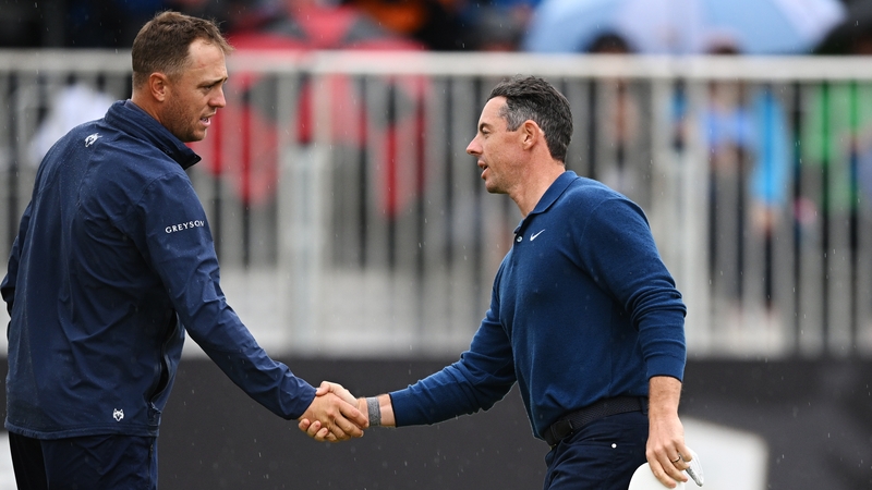 Justin Thomas (L) and Rory McIlroy