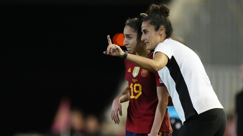 Montse Tome (R) gives Olga Carmona instructions on the sideline