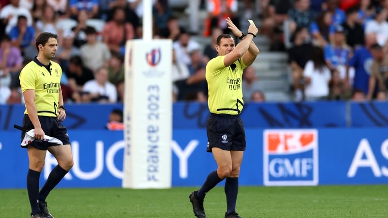 Karl Dickson gestures before showing a yellow card to Afusipa Taumoepeau