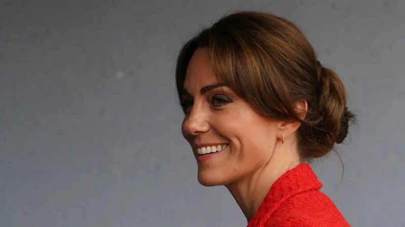 Kate wore her glossy locks in a twisted braid style (Gareth Fuller/PA)