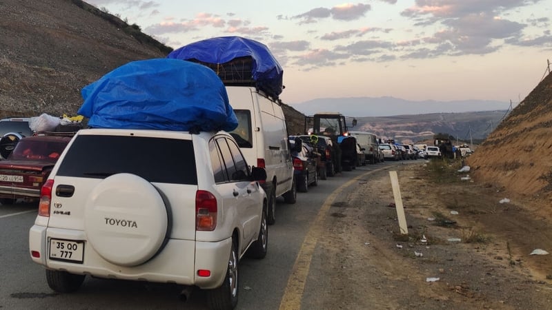 Armenians fleeing Nagorno-Karabakh sit in a long traffic queue