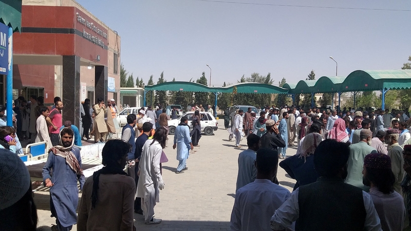 People gathered outside a hospital in Balochistan province after one of the attacks