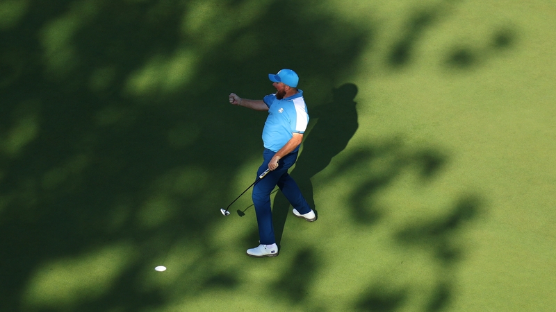 Shane Lowry celebrates a putt on the ninth green