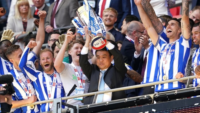 Sheffield Wednesday owner Dejphon Chansiri celebrates with the League One play-off trophy last May