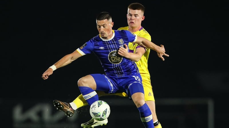 Ronan Coughlan (Waterford) and Luke Browne (Wexford) do battle in Friday night's SSE Airtricity Men's First Division fixture