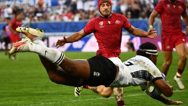 Fiji's wing Vinaya Habosi dives to score a try against Georgia
