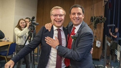 Scottish Labour leader Anas Sarwar, right, celebrates with winning candidate Michael Shanks