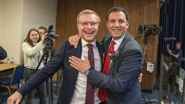 Scottish Labour leader Anas Sarwar, right, celebrates with winning candidate Michael Shanks