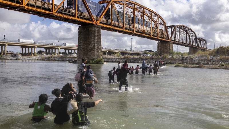 Migrants crossing the Rio Grande from Mexico into the US in Eagle Pass, Texas, last month