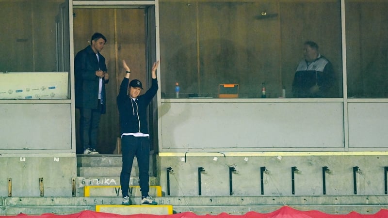 Suspended Shelbourne manager Damien Duff applauds his players from the stand
