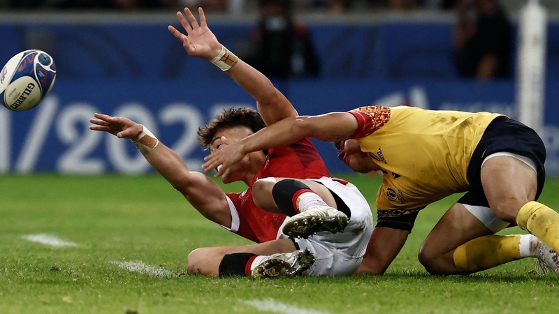 Tonga's Kyren Taumoefolau passes under pressure