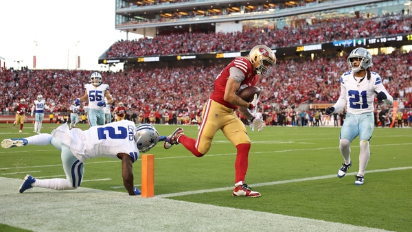 San Francisco 49ers tight end George Kittle races into the Dallas Cowboys end zone