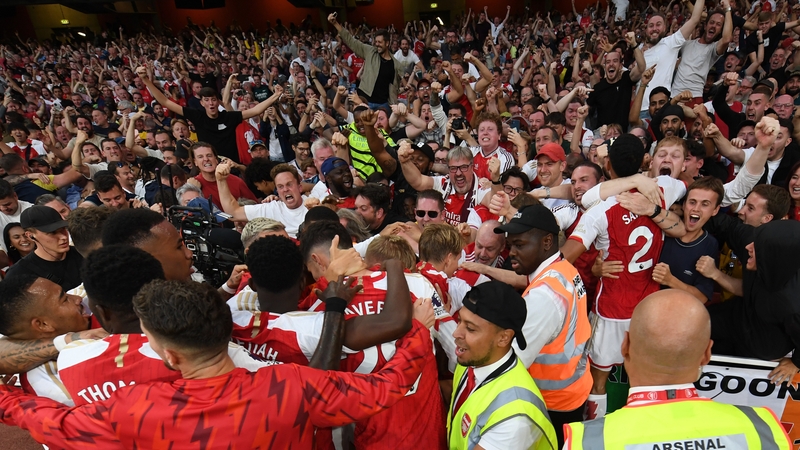 Arsenal players celebrate Gabriel Martinelli's goal with their supporters at the Emirates