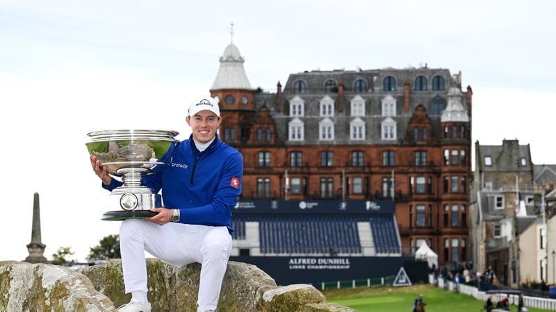 Matt Fitzpatrick of England poses with the trophy on the Swilcan Bridge at St Andrew's