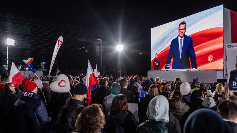 People watch last night's debate outside public broadcaster TVP's studio in Warsaw