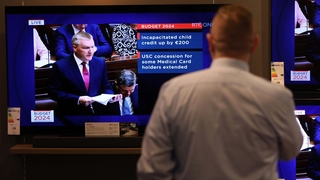 People watch the Budget on TV in Arnotts Department Store in Dublin
