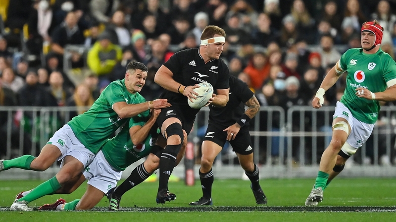 Sam Cane is tackled by Jonathan Sexton and Jamison Gibson-Park in Wellington