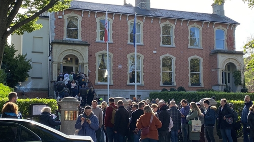 Polish citizens queued outside the Polish embassy in Dublin to vote in their country's election