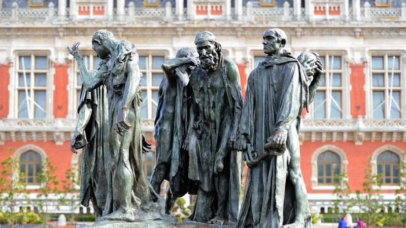 Numerous bronze and plaster versions of the statue exist around the world, such as this one outside Calais city hall in France