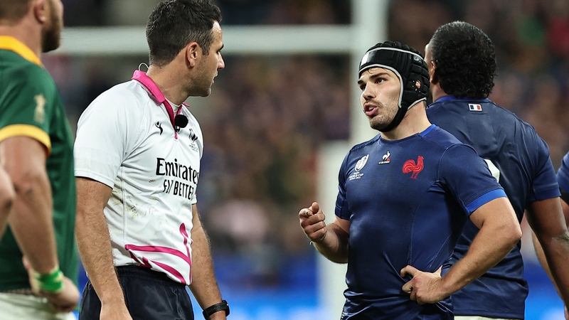France's scrum-half and captain Antoine Dupont speaks with referee Ben O'Keeffe during their quarter-final defeat to South Africa