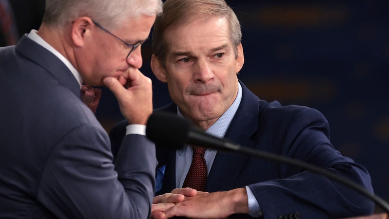 Jim Jordan (R) talks to Speaker Patrick McHenry in the chamber this evening