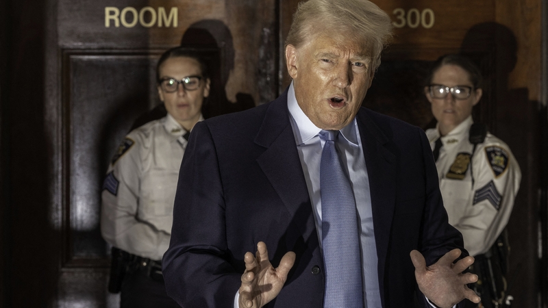 Donald Trump addresses the media on 18 October outside a New York courthouse after a separate hearing at a civil fraud trial