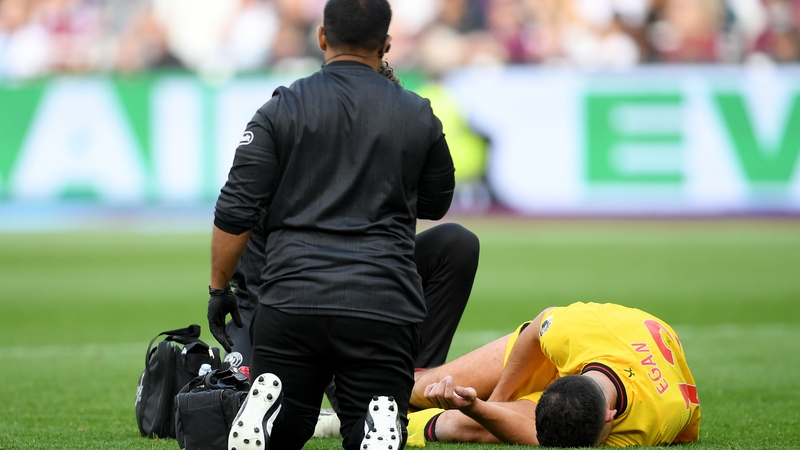 John Egan receives medical treatment against Fulham before the international window