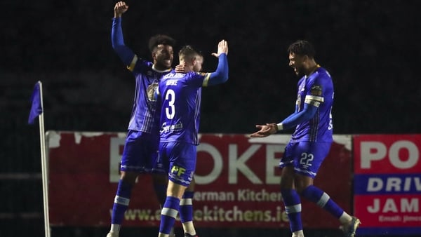 Ryan Burke of Waterford, centre, is congratulated by team-mates after scoring his sides first goal
