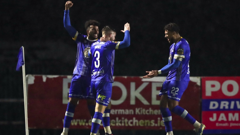 Ryan Burke of Waterford, centre, is congratulated by team-mates after scoring his sides first goal