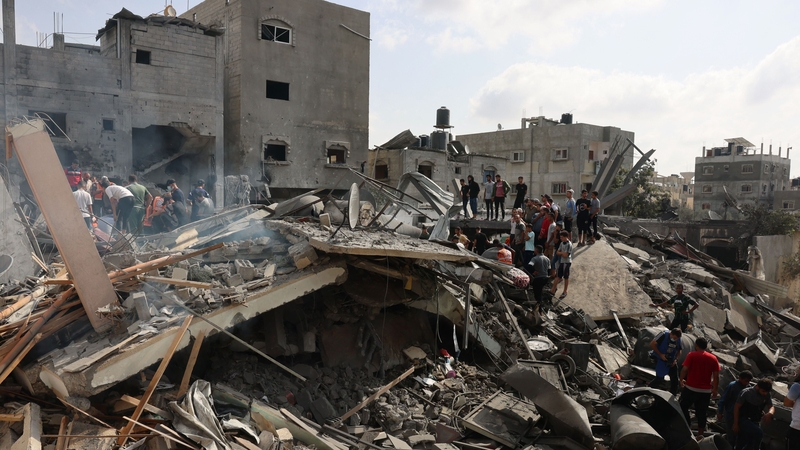 Palestinians inspect the rubble after an Israeli strike on Rafah in the southern Gaza