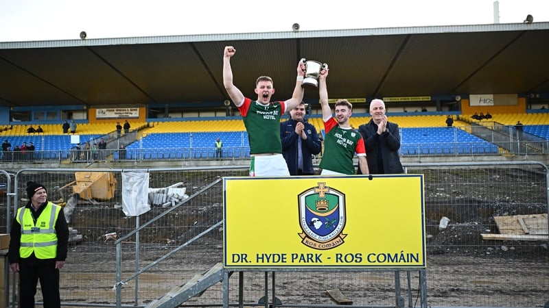 St Brigid's co-captains Mark Daly and Paul McGrath lift the cup