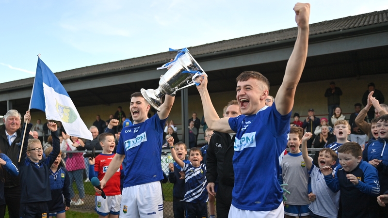 Ardee St Mary's captain Dáire McConnon and Tadhg McDonnell lift the Joe Ward Cup