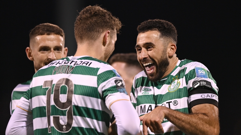Roberto Lopes, right, celebrates with Markus Poom, who scored the Hoops' fifth goal