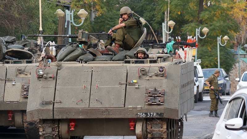 Israeli soldiers patrol an area near the northern border with Lebanon on October 23
