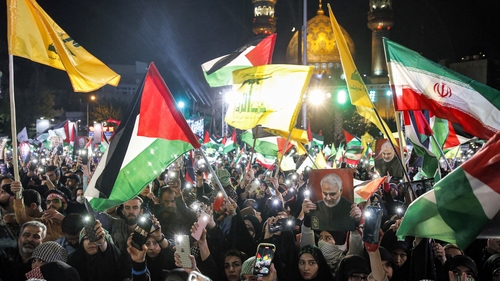Demonstrators with Iranian, Palestinian and Hezbollah flags during a protest in Tehran in support of Palestinians in the Gaza Strip on October 20th 2023. Photo: AFP