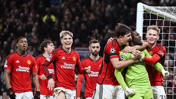 Andre Onana mobbed by his teammates after his penalty save in the final act of the game