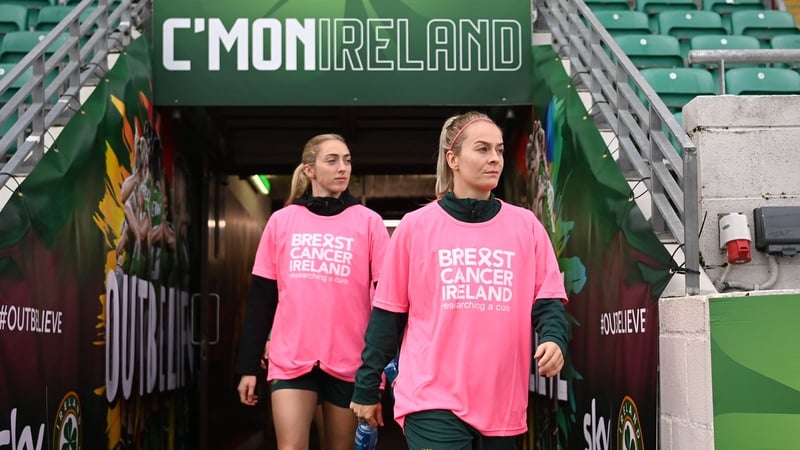 Lily Agg (R) and Megan Connolly wearing pink T-shirts in training to promote Breast Cancer Ireland's awareness month