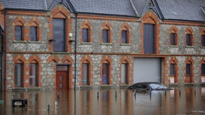 A car is submerged under water at Basin Walk Car Park