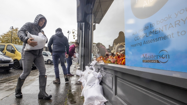 People leave sand bags at Masterson Opticians