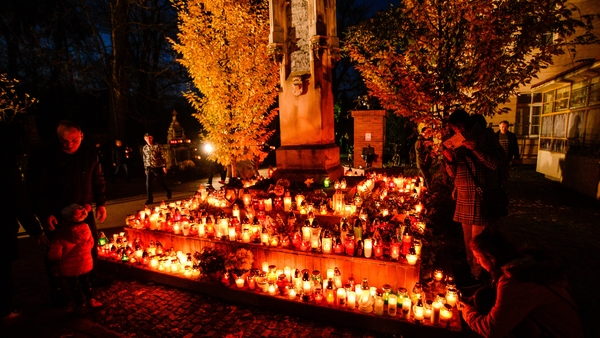 People light candles at the Rakowicki Cemetery in Krakow on All Saints' Day (file pic)