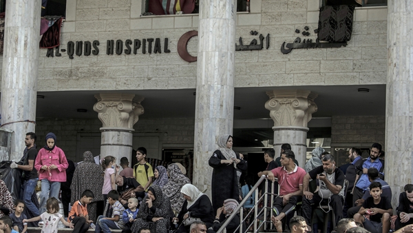 Palestinian people, who left their houses, take shelter at the al-Quds Hospital in Gaza City