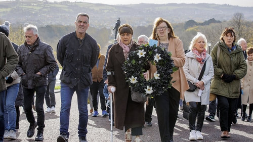 Actor James Nesbitt, centre left, walking with Joe Lynskey's niece Maria, centre, and Columba McVeigh's sister Dympna Kerr, centre right