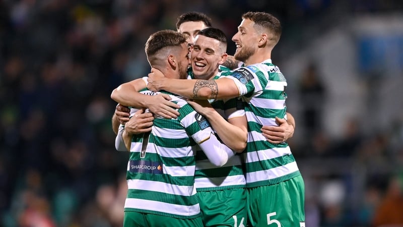 Dylan Watts, left, celebrates with teammates including Gary O'Neill after scoring the Hoops' fourth