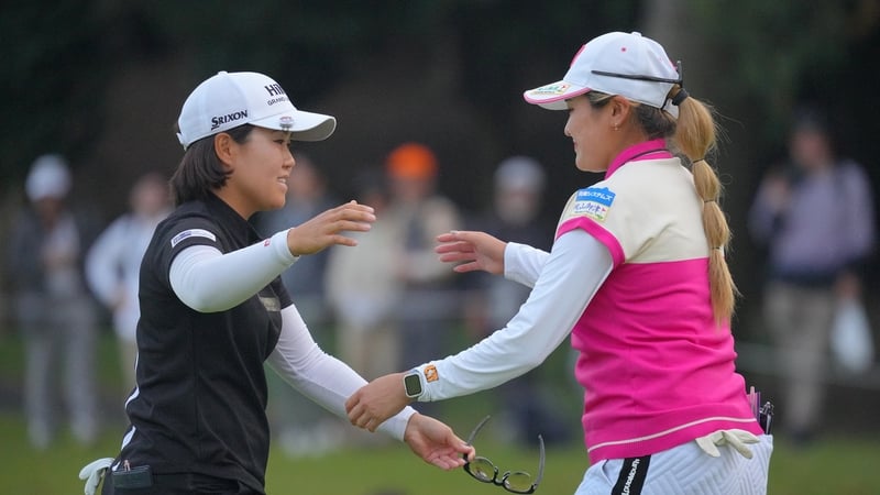 Nasa Hataoka and Shiho Kuwaki of Japan embrace after holing out on the 18th green